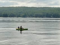 family-canoeing-on-lake-cottage-resort-scaled