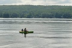 family-canoeing-on-lake-cottage-resort-scaled